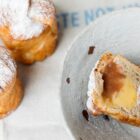 one of our rhubarb and custard cruffins chopped in half to show the rhubarb puree and custard filling